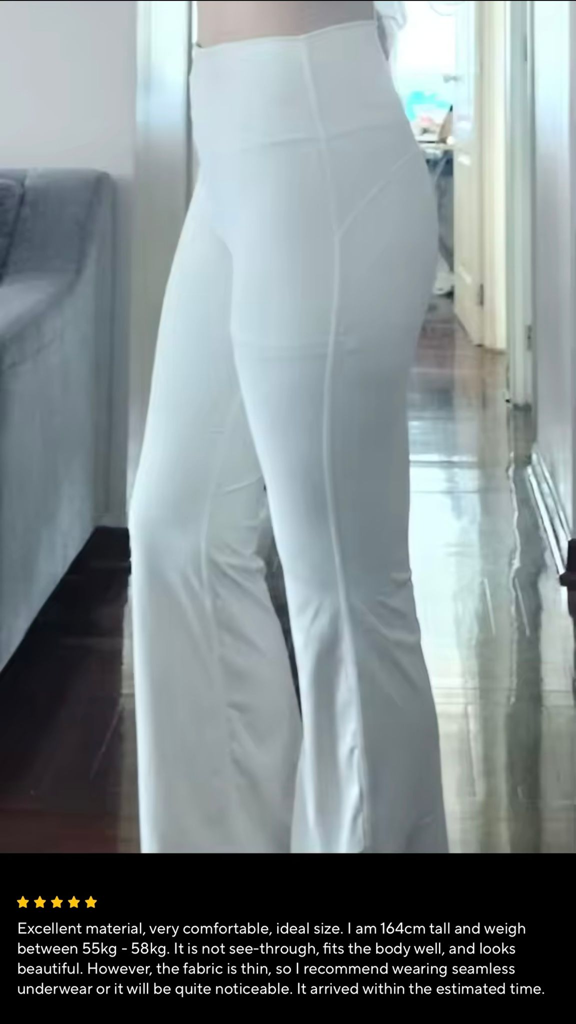 Customer close-up wearing cream leggings